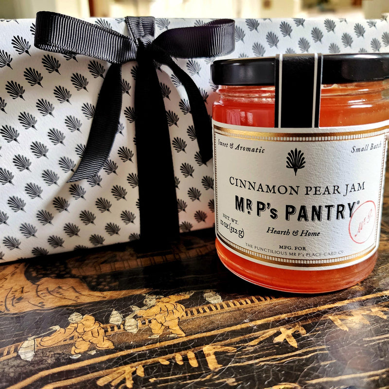 Mr. P's Pantry's Jam Trio Gift Set packaging wrapped in signature anthemion pattern with gold foil label and black grosgrain ribbon