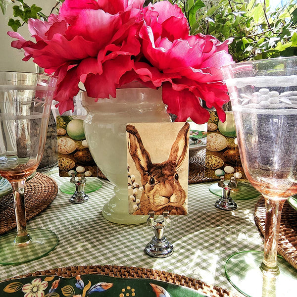 the punctilious Mr. P's Place Card Co. Hippity Hoppity illustrated custom place cards of a bunny and eggs in a tablescape of fine bone china, stemware and flowers.