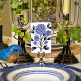 Marian McEvoy x The Punctilious Mr. P's Place Card Co collab with blue and white drawings of botanicals and floral motifs on custom place cards on a beautiful tablescape