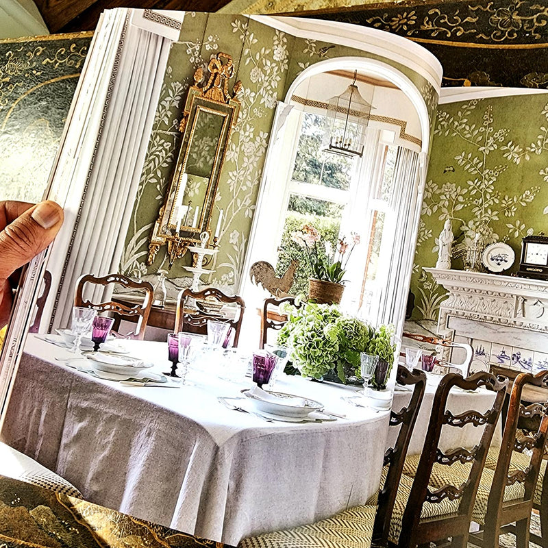 Modern English Interiors by todhunter earle book showing a stunning dining room with green and white chinoiserie wall paper