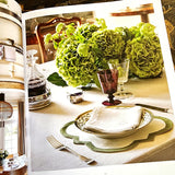 Modern English Interiors by todhunter earle book showing a tablescape with a hydrangea centerpiece and purple glasses