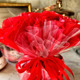 Mr. P's Pantry's jam trio "bouquet" features 3 jams wrapped in red tissue paper and cellophane that closely resembles a bouquet of flowers.