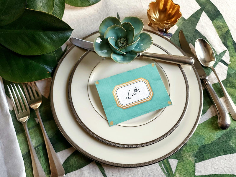 mr. p's envoy place cards on leaf printed tablecloth, vintage cutlery for weddings