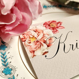 detail of showing the event size custom place cards of the Punctilious Mr. P's Place Card Co. "Peony" theme