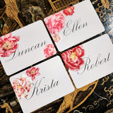 showing all four of the event size custom place cards of the Punctilious Mr. P's Place Card Co. "Peony" theme