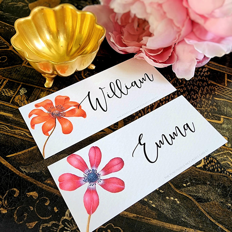 The Punctilious Mr. P's place card co. 'Anemones' laydown size custom place cards on black and gold china tablescape with fresh flowers and vintage silver cutlery