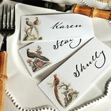 showing all three of The Punctilious Mr. P's Place Card Co. 'Fanciful Pheasants' custom laydown place card on top of a white dinner plate and bamboo cutlery