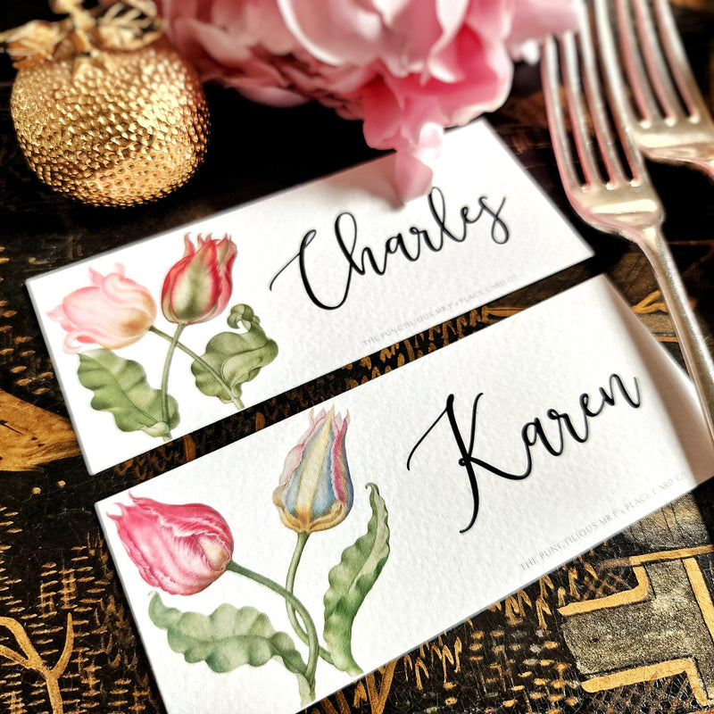 showing both of The Punctilious Mr. P's place card co. 'Parrot Tulips' laydown size custom place cards on black and gold china tablescape