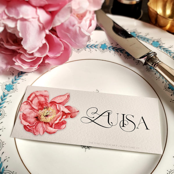 The Punctilious Mr. P's place card co. 'Peony' laydown size custom place cards on black and gold china tablescape with fresh flowers and vintage silver cutlery
