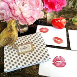The Punctilious Mr. P's Place Card Co. 'Kisses' custom note card pack with a montblanc fountain pen on a cup of tea