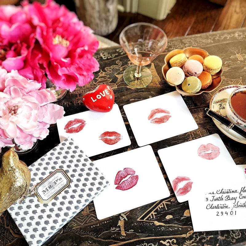 The Punctilious Mr. P's Place Card Co. 'Kisses' custom note card pack with a montblanc fountain pen on a cup of tea