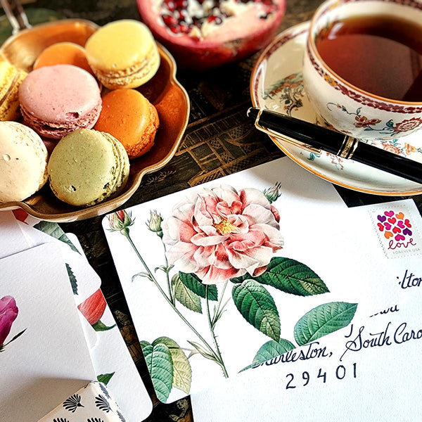 The Punctilious Mr. P's Place Card Co. 'Rose Garden' custom note card pack with a montblanc fountain pen on a cup of tea