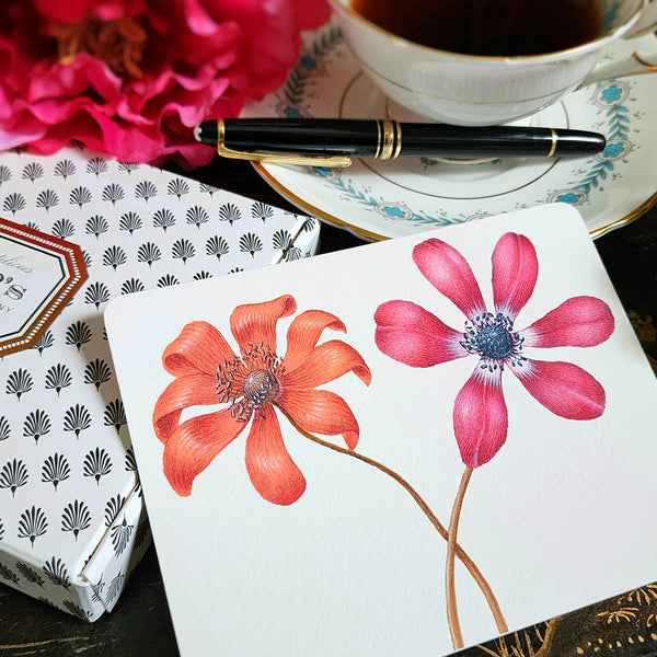 The Punctilious Mr. P's Place Card Co. 'Anemones' custom note card pack with a montblanc fountain pen on a chinoiserie table with cup of tea and large beautiful peony flower