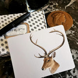 The Punctilious Mr. P's Place Card Co. 'Deer' custom note card pack on a black marble table with signature anthemion note card box and fountain pen and bronze medallion in the background