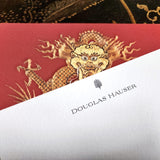 detail of back of The Punctilious Mr. P's Place Card Co. 'Radiant Dragon-Cinnabar' custom note card on a chinoiserie table showing a name personalized at the top of the card 