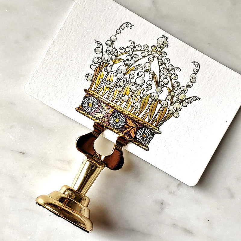 The Punctilious Mr. P's Place Card Co. 'Coronet Nouveau' custom place card on top of a marble tabletop