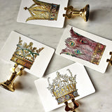 showing all four  of The Punctilious Mr. P's Place Card Co. 'Coronet Nouveau' custom place card on top of a marble tabletop