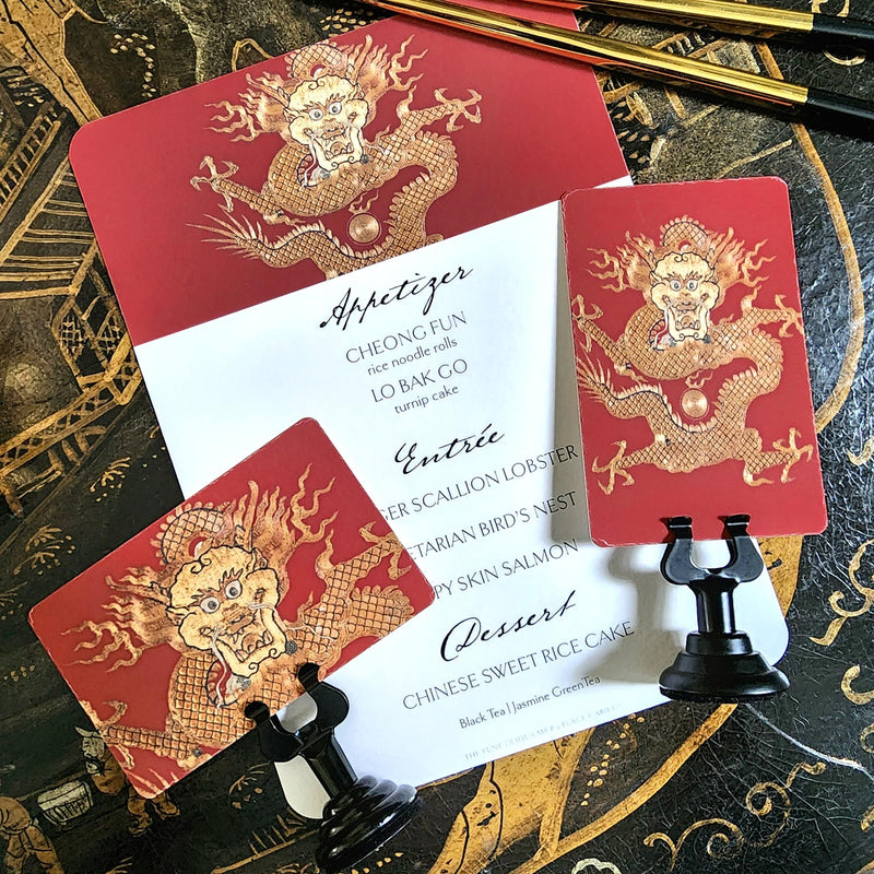 The Punctilious Mr. P's Place Card Co. 'Radiant Dragon-Cinnabar' Custom Place Cards on a chinoiserie inspired table with flowers and chopsticks and coordinating menu