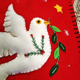 detail of the punctilious mr. p's place card co. christmas stocking dove head and body with greenery in mouth
