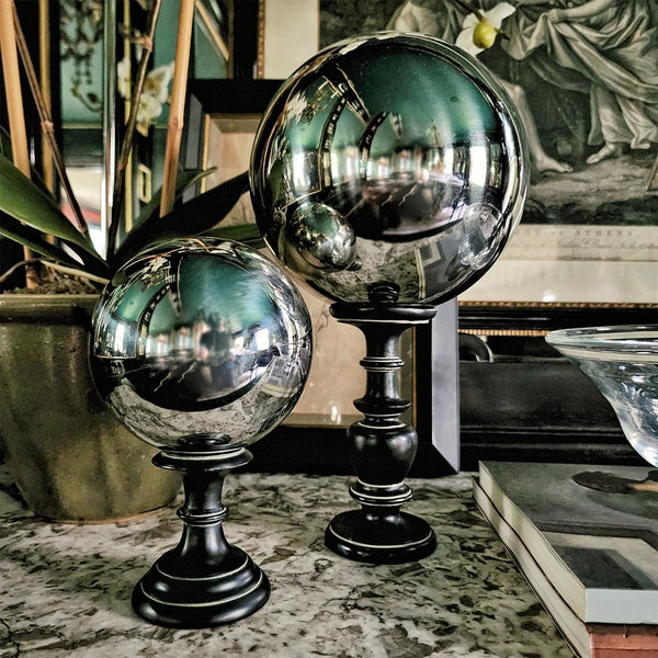 The punctilious mr. p's place card co. short and tall turned black bases paired with steel balls/ orbs on top that give old world charm