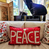 The punctilious mr. p's place card co. red 'peace' pillow showing the letters P-E-A-C-E Sewn on by hand, crowned with an appliqued white dove the yellow living room of the Coopers with baby grand piano in the background