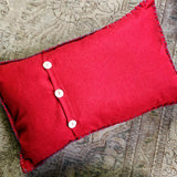 back of the peace pillow with 3 pearl buttons for a closure