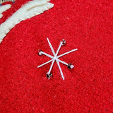 detail of a hand embroidered star on the peace pillow