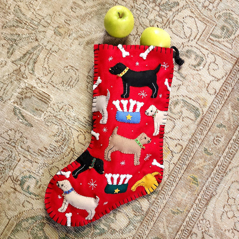 THE PUNCTILIOUS MR. p's place card co. puppy love handmade felt christmas stocking of dogs and bones on a tapestry rug