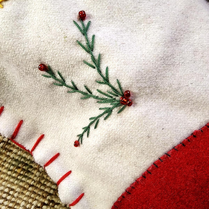 detail of THE PUNCTILIOUS MR. p's place card co. skiing santa christmas stocking fine hand stitching