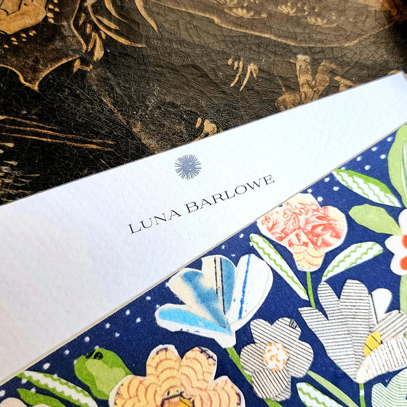 detail of the personalization of the name in the larger, fancier font printed at the top of the note card's marquee just below sarah's small sun face logo.