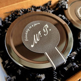 detail of the taper tab on top of the jam jar inscribed with the slogan, "Friendship in a jar.®"