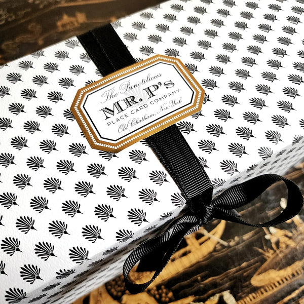 Mr. P's Pantry's Jam Trio Gift Set packaging wrapped in signature anthemion pattern with gold foil label and black grosgrain ribbon