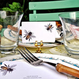 The Punctilious Mr. P's Place Card Co. Bees custom place cards on a al fresco table with custom menus and bamboo cutlery