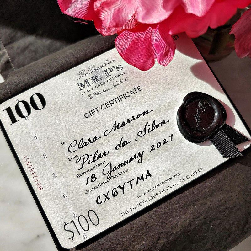 The Punctilious Mr. P's $100 Boxed Gift Certificate with wax seal and grosgrain ribbon whose design is inspired by vintage bank notes with recipient's name calligraphed by hand