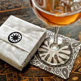 The Punctilious Mr. P's collaboration with marian mcevoy (aka gust the poodle) european pulp board drinks coasters wrapped in Mr. P's signature anthemion tissue paper