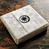 The Punctilious Mr. P's collaboration with marian mcevoy (aka gust the poodle) european pulp board drinks coasters wrapped in Mr. P's signature anthemion tissue paper