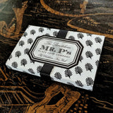 The punctilious Mr. P's Place card co. iconic packaging featuring their black and white anthemion pattern