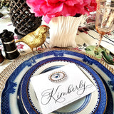 The Punctilious Mr. P's 'The Lover's Eye' laydown event size size place cards on blue and white china tablescape