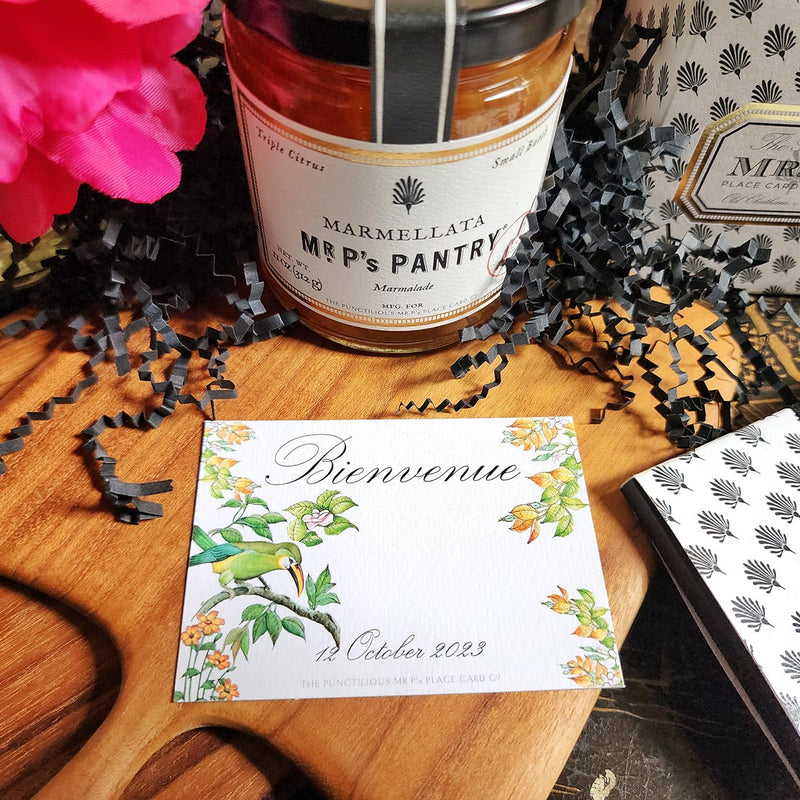 The Punctilious Mr. P's Place Card Co. "Birds of India" Custom Gift Notes on a chinoiserie table with marmalade jam, cutting board and fresh flowers