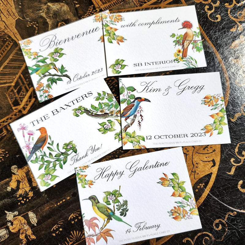 showing 5 of the 9 Punctilious Mr. P's Place Card Co. "Birds of India" Custom Gift Notes on a chinoiserie table