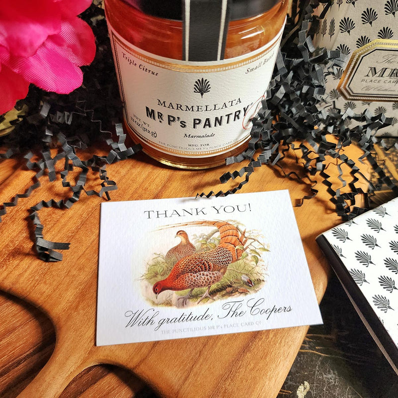 The Punctilious Mr. P's Place Card Co. "Fiery Pheasants" Custom Gift Notes on a chinoiserie table with mr. p's marmalade jam on a teak cutting board