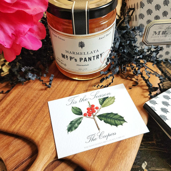 The Punctilious Mr. P's Place Card Co. "Holly" Custom Gift Notes on a chinoiserie table with marmalade jam, cutting board and fresh flowers