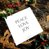 The Punctilious Mr. p's place card co. collab with sarah v battle showing back of  holiday card that reads: peace, love, joy