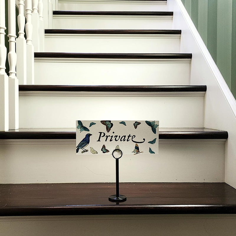 The Punctilious Mr. P's Place Card Co. "Blue Butterflies Custom Illustrated Signage" on a black stand that says "Private" to let your guests know your house rules, or to welcome them to your wedding event