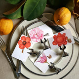 showing all 4 of The Punctilious mr. P's Pace Card Co. "Blossoms" custom place card on a silver place card holder with magnolia leaves and lemons in the background against a chinoiserie screen