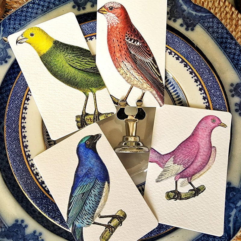 The Punctilious Mr. P's Place Card Co. 'Chromatic Cuckoo' custom place cards on a beautiful tablescape showing all 4 colors of the birds