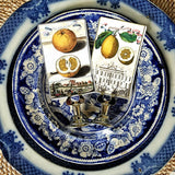 The Punctilious Mr. P's Place Card Co. 'Citrus Gardens' custom place cards on a stunning blue and white tablescape