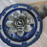 video of Handcrafted blue-and-white ceramic camellia blossom with navy-tipped petals from The Punctilious Mr. P's Place Card Co.