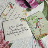 Video of birds of india custom invitation with Envelopes with calligraphy and a pen on a textured surface