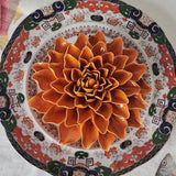 Handcrafted rust-glazed ceramic dahlia blossom with tightly layered petals from The Punctilious Mr. P's Place Card Co.